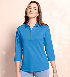model wearing a blue 3/4 sleeve top and blue jeans