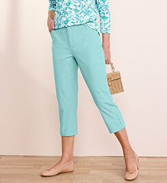 model wearing green pants and light tan shoes