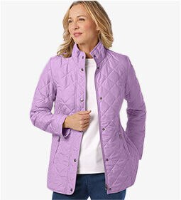 woman wearing light purple jackets, white shirt, and blue jeans