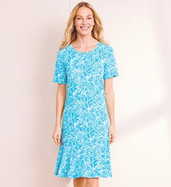 model wearing a blue and white patterned dress