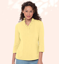 model wearing a yellow shirt and blue jeans