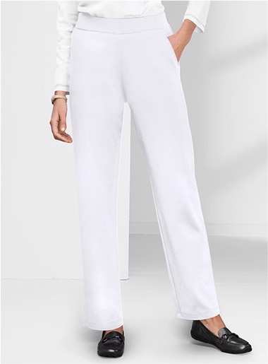 bottom half of model wearing white pants