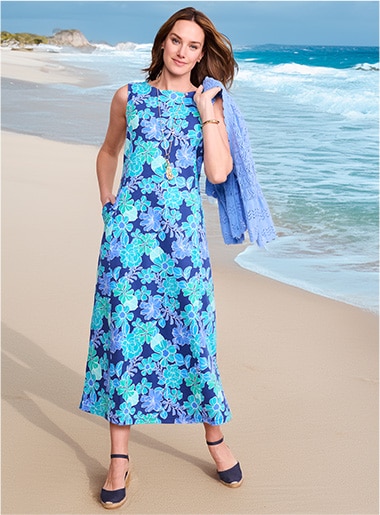 model wearing floral dress in several blue hues