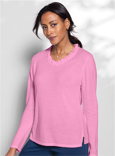 model wearing pink ruffled collar top