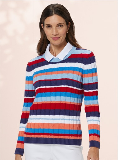 model wearing a striped sweater and white pants